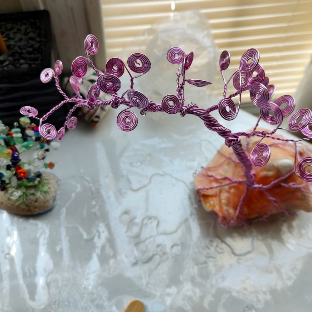 Wire tree on seashell